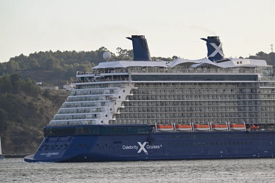 A modern cruise ship on the ocean at sunset, representing the cruise line industry's growth.