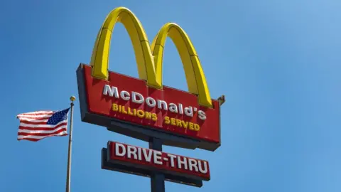 Modern fast food restaurant exterior at dusk