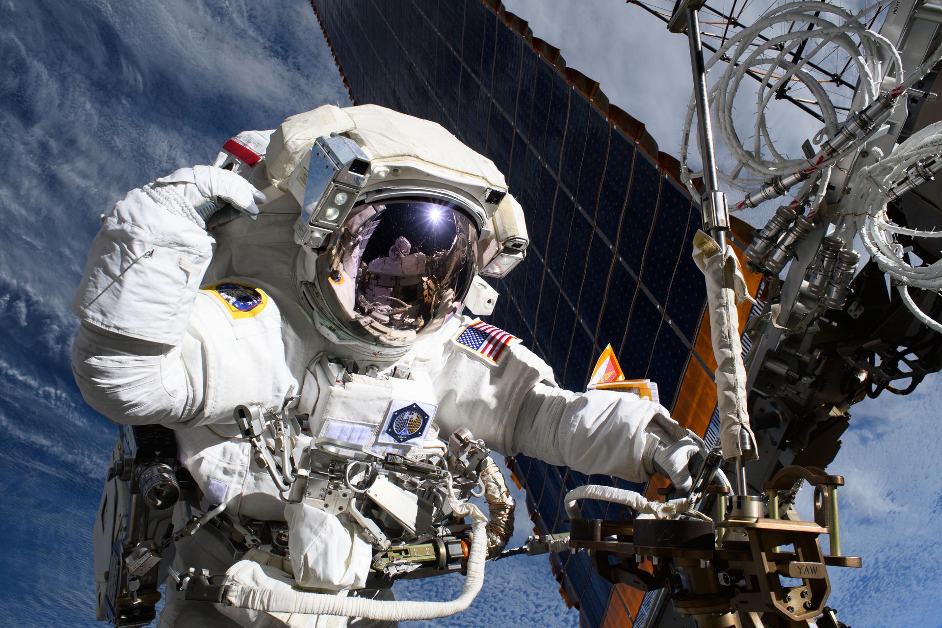NASA astronauts work outside the ISS during May 2025 spacewalk, highlighting the spacewalk glove issue