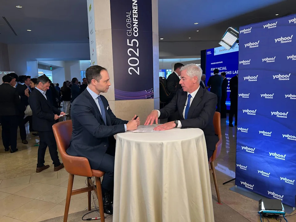 Bill Ackman at a business conference, discussing his investment strategy