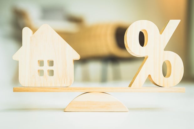 Modern house with mortgage documents – mortgages in 2025