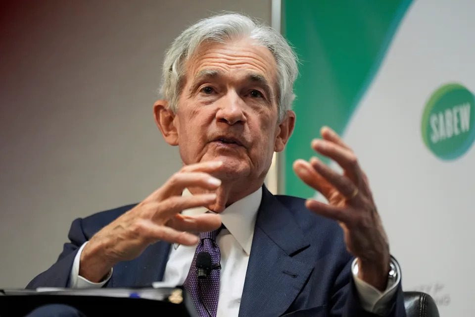 Federal Reserve building with analysts watching the fed meeting today