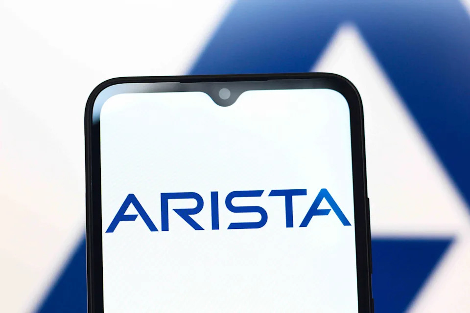 Arista Networks, Inc. headquarters with ANET stock performance chart overlay