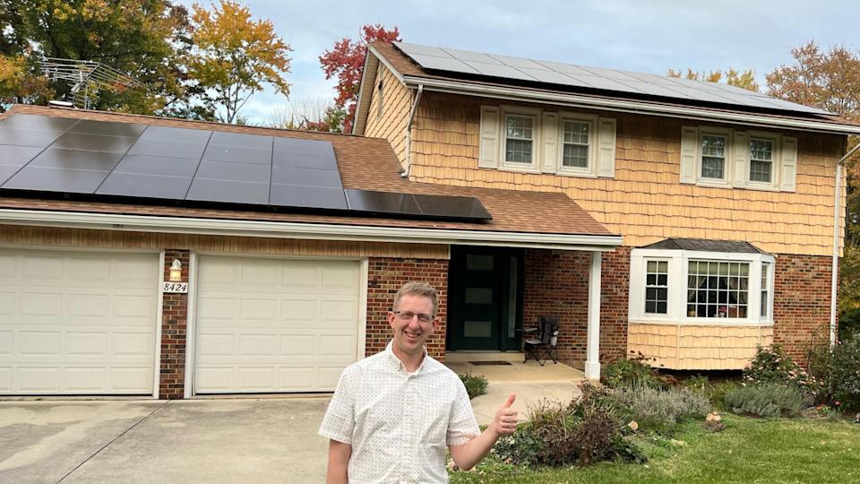 Residential solar panels with bright blue sky – solar incentives help homeowners save money
