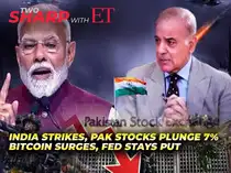 Traders monitor charts at the Pakistan Stock Exchange amid market volatility.