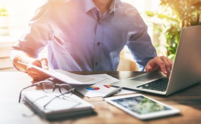 A person reviewing their savings account statement, focusing on maximizing savings