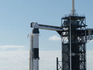 Falcon 9 rocket lifts off during a recent SpaceX launch, preparing to deploy Starlink satellites into orbit. The sky glows as the rocket streaks upward.