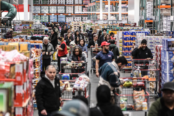 Grocery shopper reviewing prices during the latest inflation trends in 2025