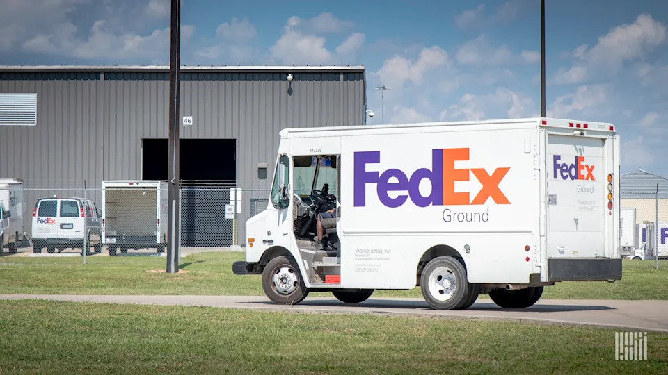 Amazon delivery truck unloading large packages
