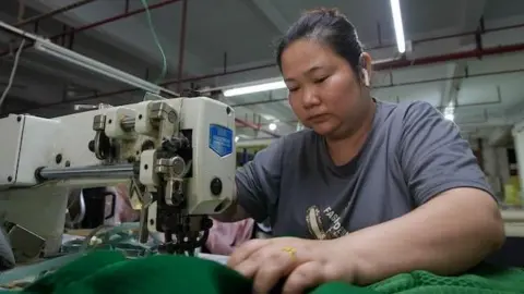 A Chinese factory floor affected by Trump tariffs, illustrating economic impact and changing supply chains.