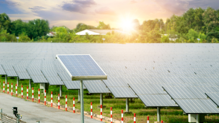 Aerial view of an Ameren Missouri facility with solar panels and power lines, highlighting sustainable energy efforts