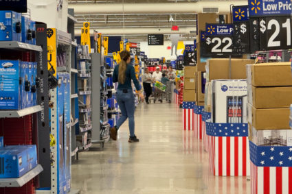 People shopping in a supermarket during inflationary times