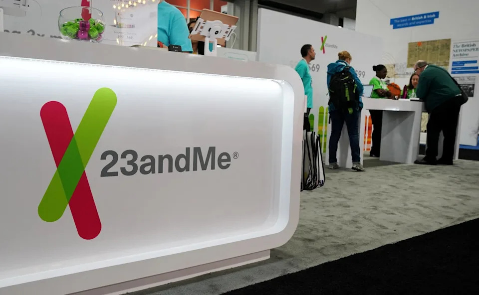 Lab scientists reviewing genetic data as part of the Regeneron 23andme acquisition